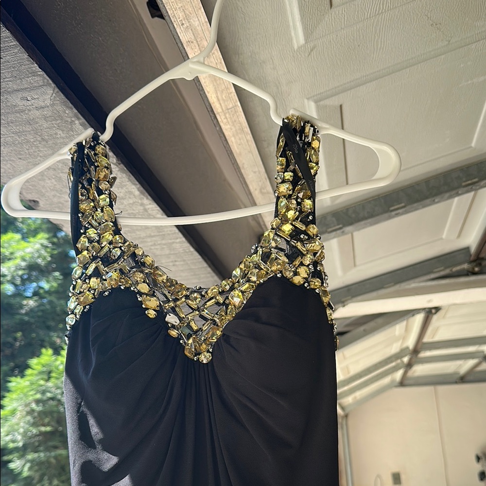 Elegant Black Dress with Gold Embellishments